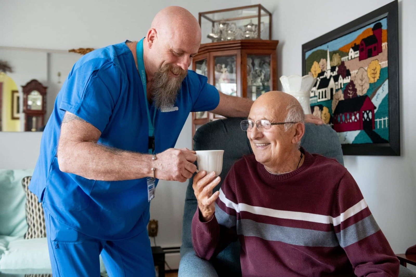 A professional caregiver supporting a senior at home so family can rest