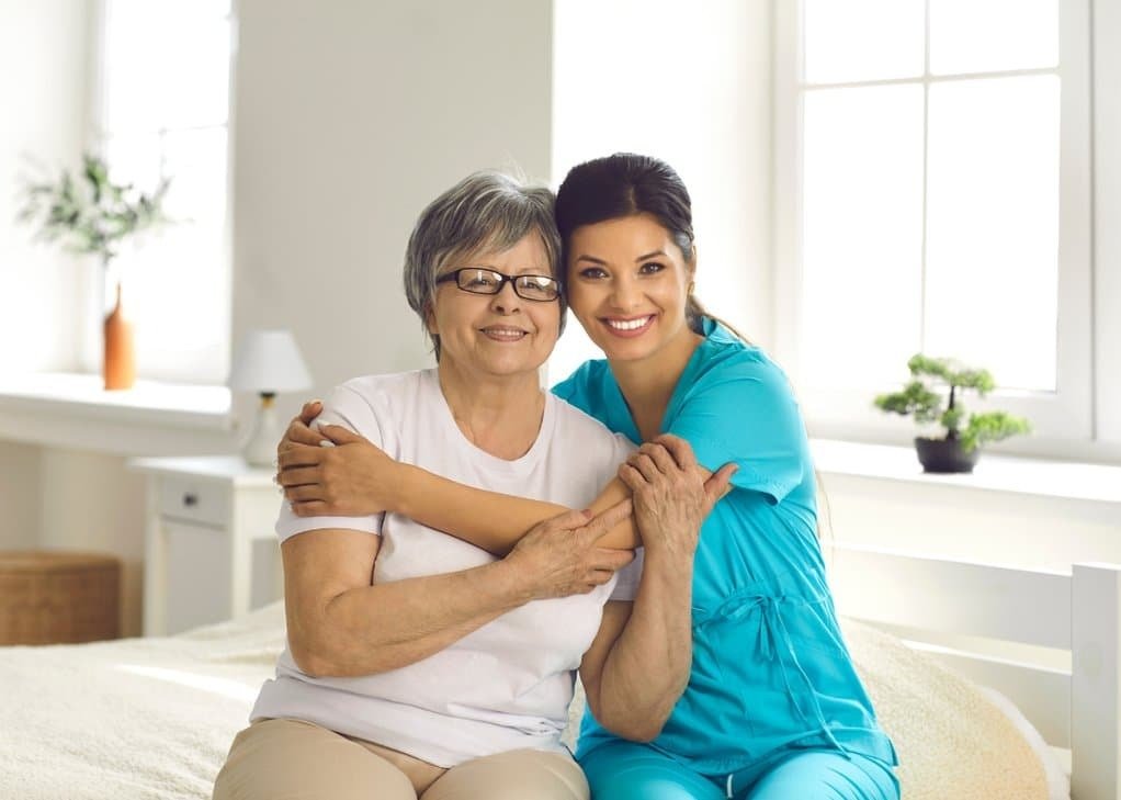 Seniors enjoying a bright, active day outdoors with caregiver support